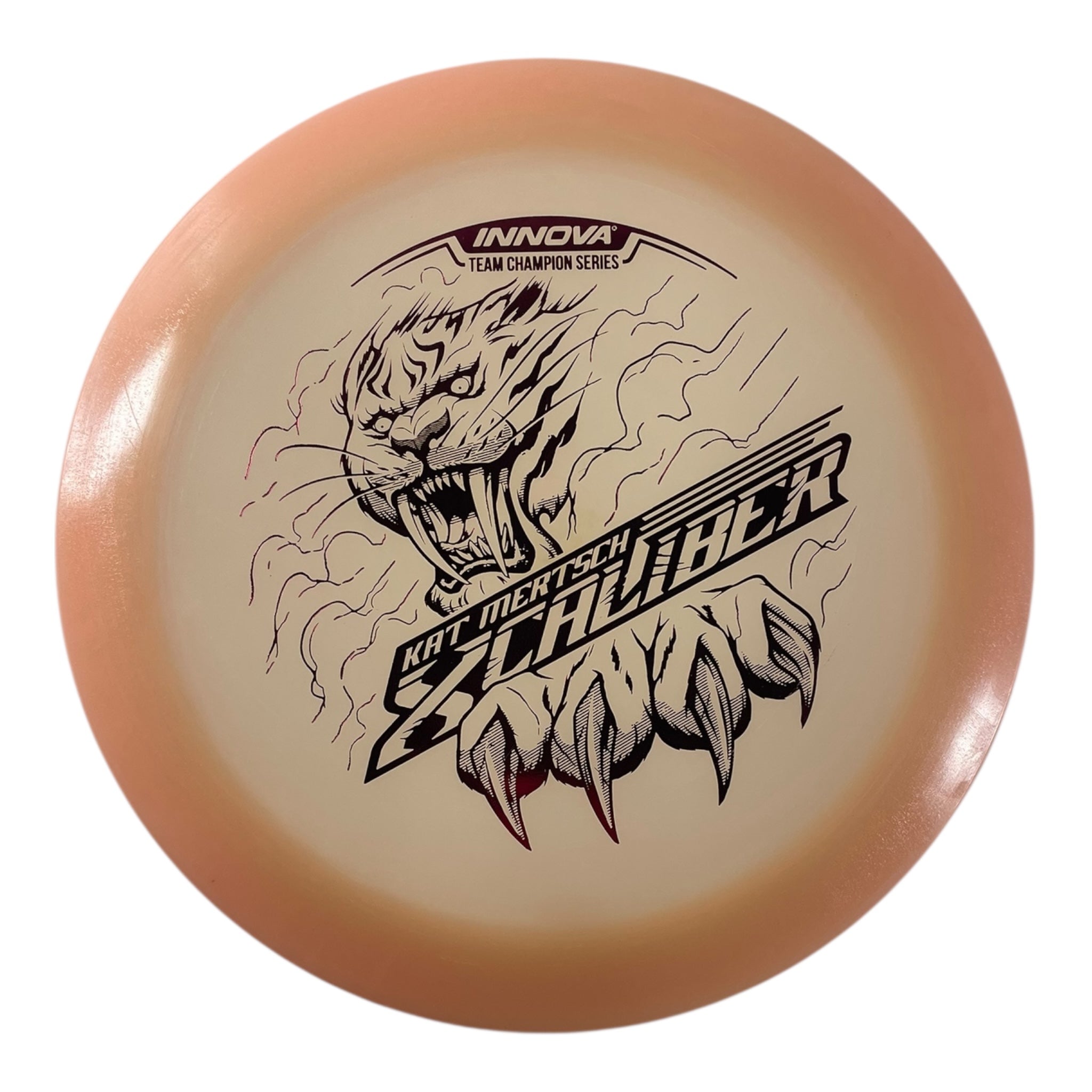 Innova Champion Discs XCaliber | Champion Color Glow | Tan/Pink 175g (Kat Mertsch) Disc Golf