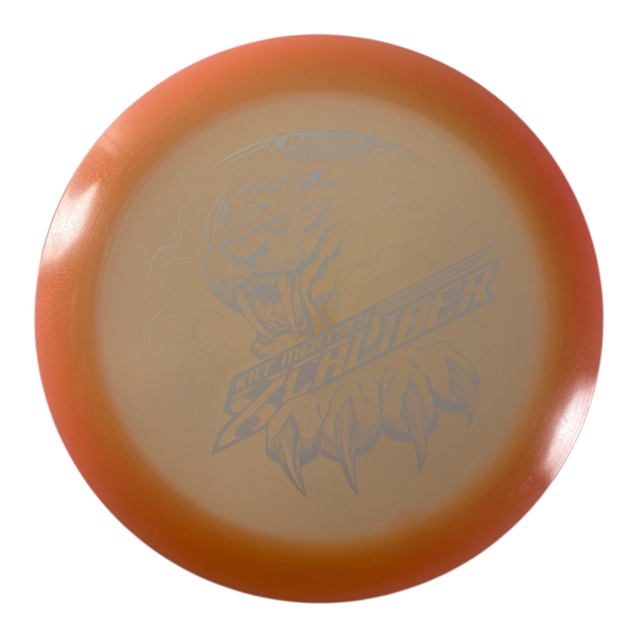 Innova Champion Discs XCaliber | Champion Color Glow | Tan/White 175g (Kat Mertsch) Disc Golf