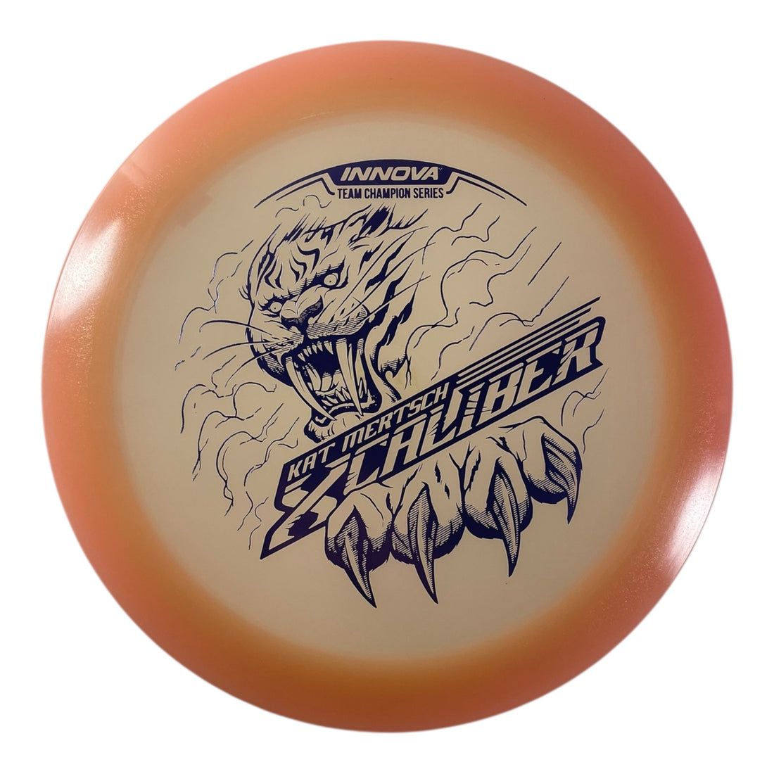 Innova Champion Discs XCaliber | Champion Color Glow | Tan/Purple 175g (Kat Mertsch) Disc Golf