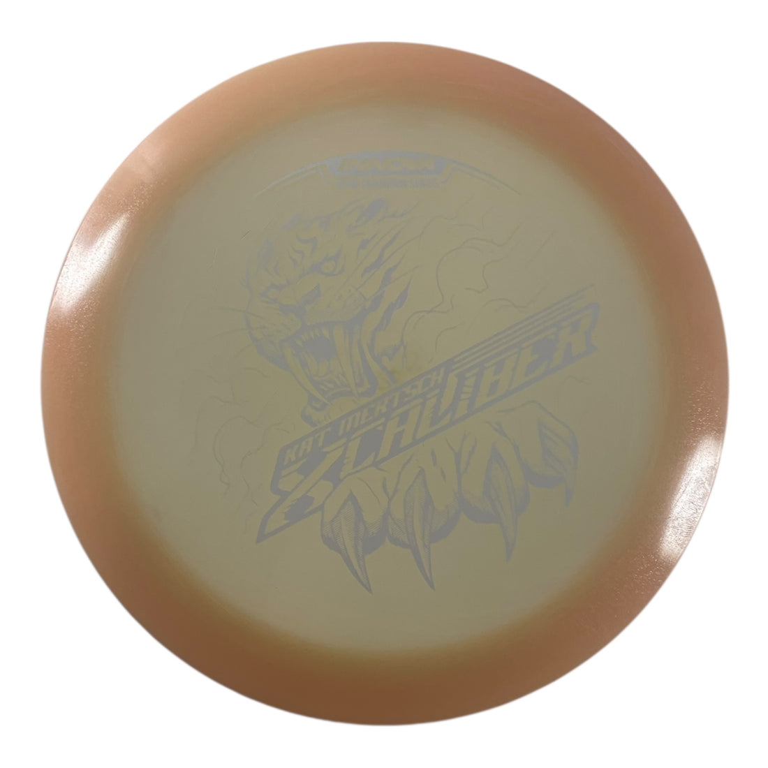 Innova Champion Discs XCaliber | Champion Color Glow | Tan/White 175g (Kat Mertsch) Disc Golf